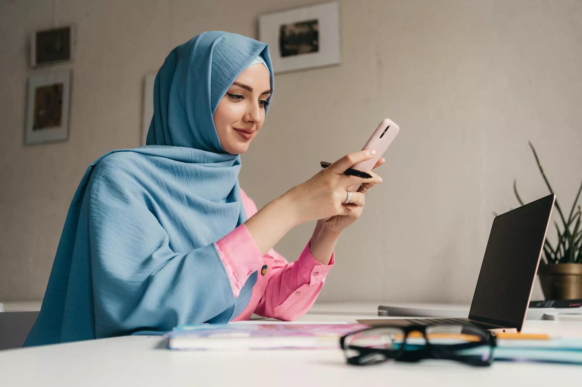 modern muslim woman in hijab in office room